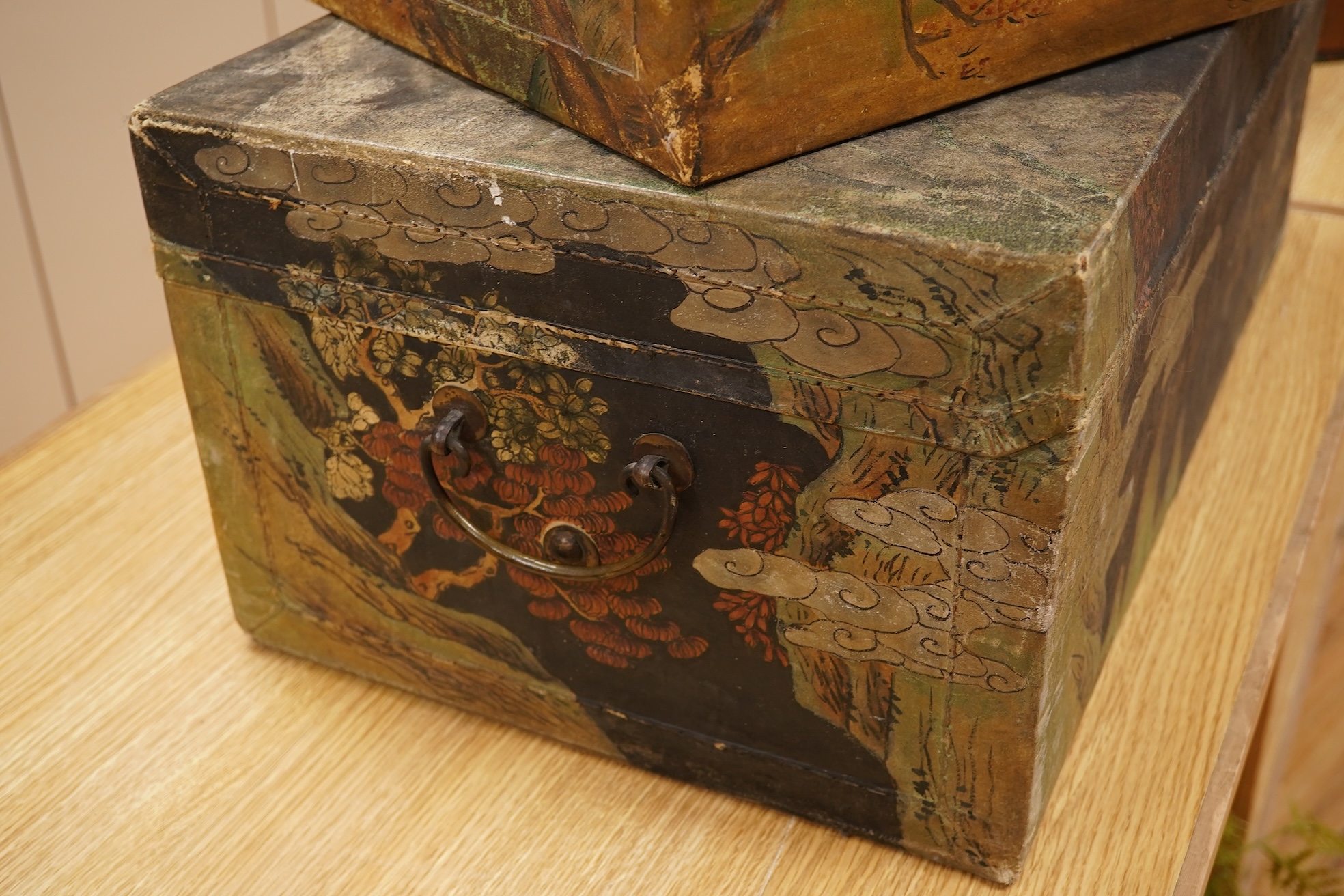 Two Chinese polychrome decorated hide chests, largest 56cm wide
